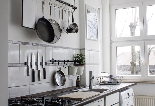 Modern kitchen remodel with white cabinetry and stone countertops